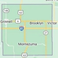 Road map of Poweshiek County, Iowa, showing major towns including Grinnell, Brooklyn, Victor, and Montezuma along with highways I-80, Highway 63, Highway 146, and Highway 21.