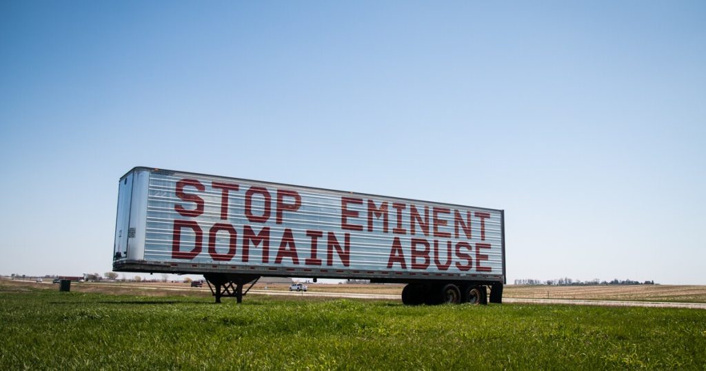 Stop Eminent Domain Abuse sign on farmland in Iowa