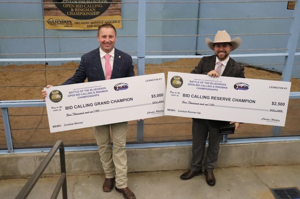 David Whitaker holding a championship check after winning the Battle of the Bluegrass Auctioneer Championship in Lexington, Kentucky