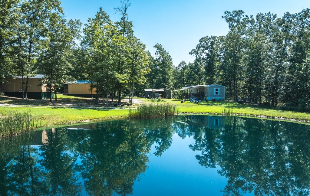 Dent County Missouri cabin rental business for sale featuring cabins, mobile home, and fishing pond near the Current River