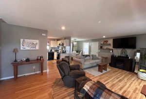 Open living room and kitchen layout inside ranch home for sale in Cuba Missouri