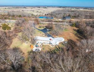 Frank Lloyd Wright inspired home for sale on 6.88 acres with pond near Rolla Missouri in Phelps County
