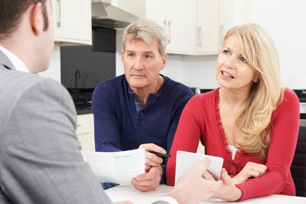 landowner interviewing real estate agent before selling farmland
