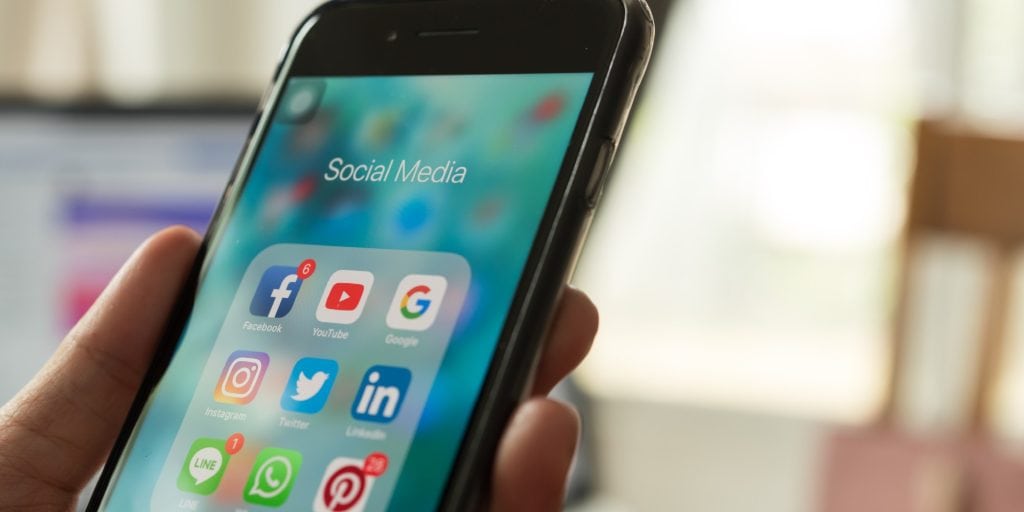 social media apps on smartphone used for marketing land and rural property