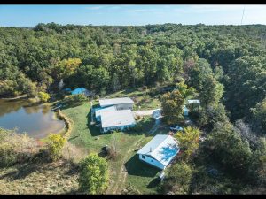 Steelville Missouri land for sale with private lake, home, and wooded acreage in Crawford County