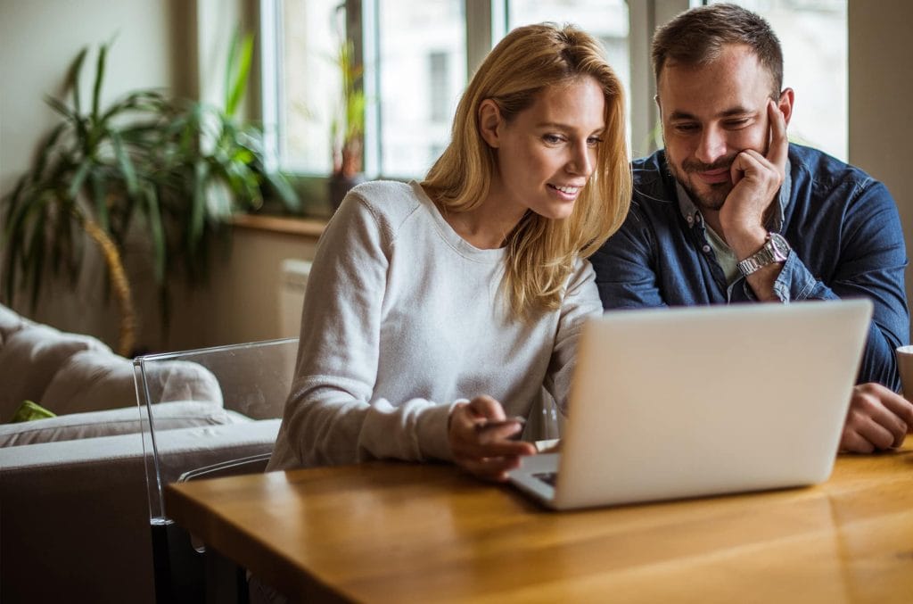 Choosing between two land agents while reviewing property sale options online