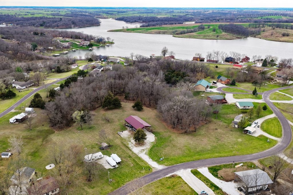 Lake Thunderhead lot for sale in Putnam County Missouri aerial view showing lake access, nearby homes, and private setting