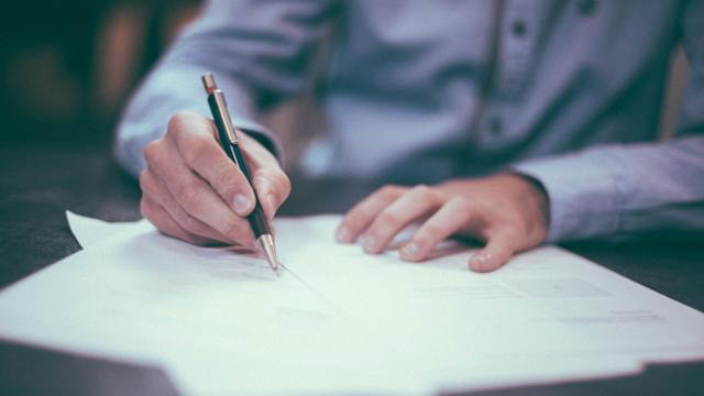 Signing a listing agreement for land sale with real estate broker