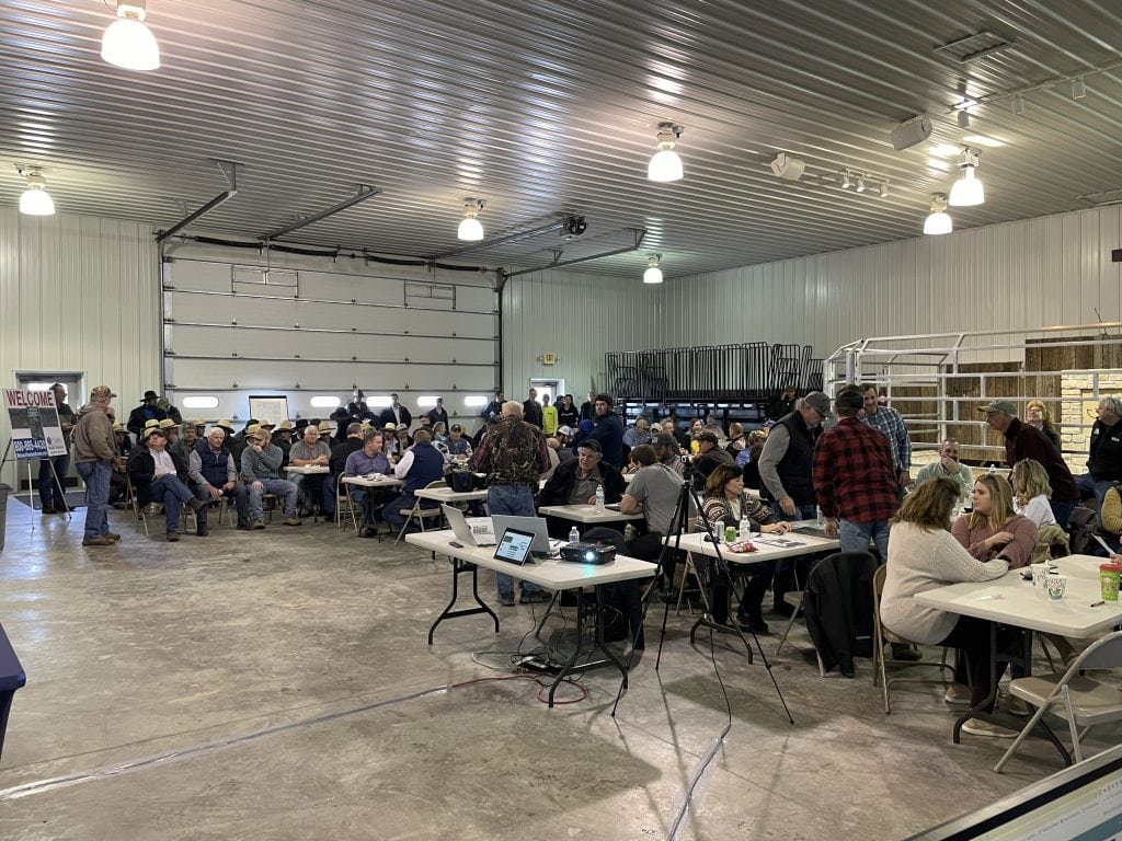 Crowd of buyers attending a competitive Midwest farmland auction by Whitaker Marketing Group