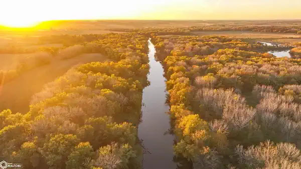 Conservation land with river and timber improving long-term land value