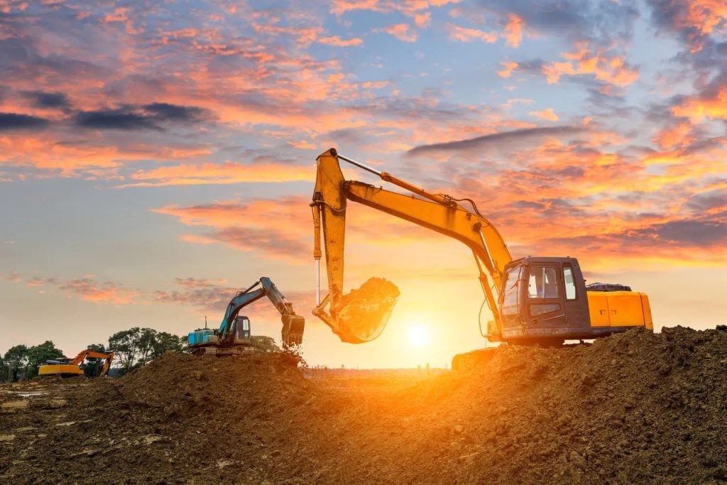 Development land site preparation with excavators working on Midwest property