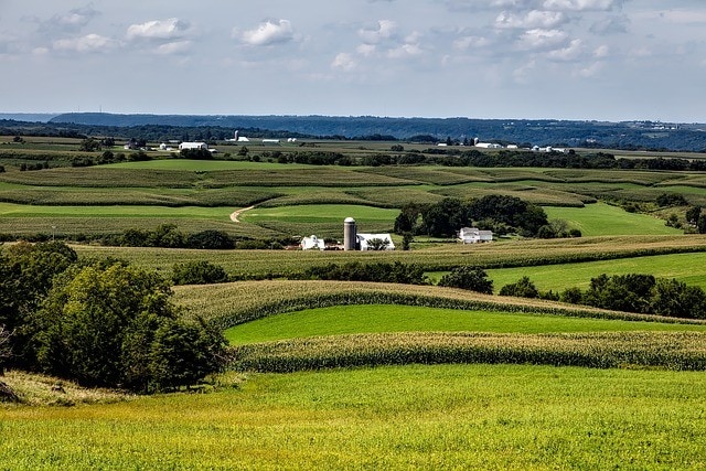 Rolling Iowa farmland representing agricultural land investment opportunities