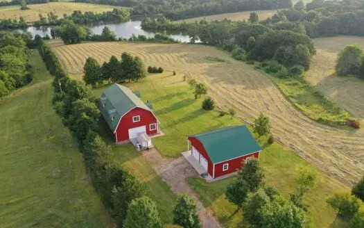 Rural residential property with acreage, barns, and recreational land