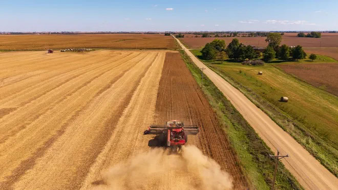 Highly farmable Midwest farmland being harvested during harvest season